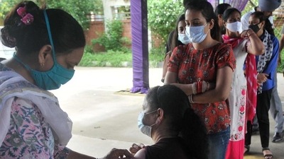 A health worker administers Covid vaccine to a resident in Mohali. (Ravi Kumar/HT)