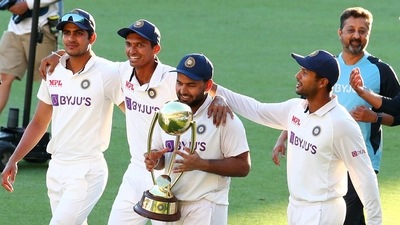 India's Rishabh Pant carries the trophy as he celebrates with his teammates after defeating Australia by three wickets on the final day of the fourth cricket test at the Gabba, Brisbane, (AP) India's Rishabh Pant carries the trophy as he celebrates with his teammates after defeating Australia by three wickets on the final day of the fourth cricket test at the Gabba, Brisbane, (AP)