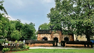 The mosque’s courtyard is filled with wet green leaves The mosque’s courtyard is filled with wet green leaves