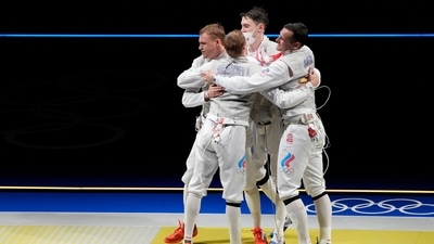 Kirill Borodachev of the Russian Olympic Commettee, left, celebrates with his teammates defeating Alexander Massialas of the United States in the men's Foil team semifinal competition at the 2020 Summer Olympics, Sunday, Aug. 1, 2021, in Chiba, Japan. (AP Photo/Hassan Ammar) (AP) Kirill Borodachev of the Russian Olympic Commettee, left, celebrates with his teammates defeating Alexander Massialas of the United States in the men's Foil team semifinal competition at the 2020 Summer Olympics, Sunday, Aug. 1, 2021, in Chiba, Japan. (AP Photo/Hassan Ammar) (AP)