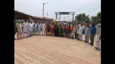Farmers protesting near the inland container depot owned by the Adani Group at Kila Raipur in Ludhiana district. Farmers protesting near the inland container depot owned by the Adani Group at Kila Raipur in Ludhiana district.