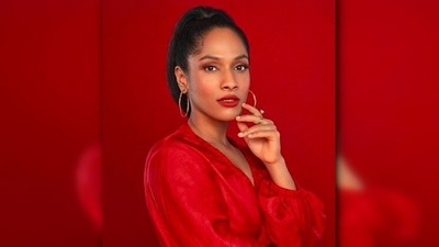 In another, she posed in a bright red wrap top. With blushed cheek and lips, Masaba accessorised her look with hoop earrings. (Instagram/@masabagupta) In another, she posed in a bright red wrap top. With blushed cheek and lips, Masaba accessorised her look with hoop earrings. (Instagram/@masabagupta)