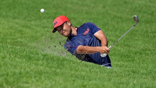 Xander Shauffele of United States plays a shot from a bunker on the 12th hole during the final round of the men's golf event at the 2020 Summer Olympics on Sunday, Aug. 1, 2021, in Kawagoe, Japan. (AP Photo/Andy Wong)(AP)
