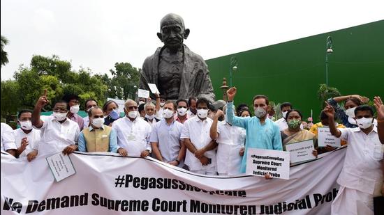 Congress leader Rahul Gandhi with other party leaders stage a protest near Gandhi statue against Pegasus project on July 23. (PTI) Congress leader Rahul Gandhi with other party leaders stage a protest near Gandhi statue against Pegasus project on July 23. (PTI)