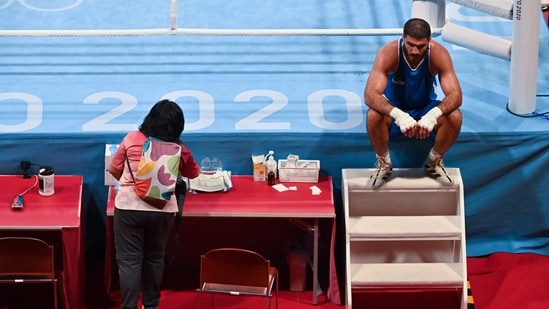 France's Mourad Aliev reacts reacts after losing by disqualification against Britain's Frazer Clarke during their men's super heavy (over 91kg) quarter-final boxing match during the Tokyo 2020 Olympic Games at the Kokugikan Arena in Tokyo on August 1, 2021. (Photo by Luis ROBAYO / AFP)(AFP)