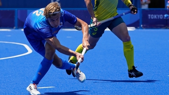 Netherlands' Justen Blok (32) passes against Australia's Tom Joseph Wickham (5) during a men's field hockey match at the 2020 Summer Olympics, Sunday, Aug. 1, 2021, in Tokyo, Japan. (AP Photo/John Minchillo)(AP)