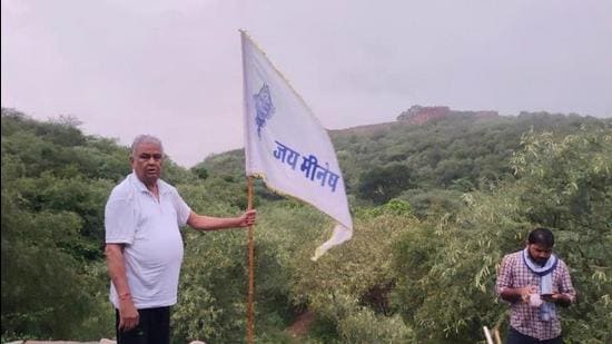 BJP MP Kirori Meena put up a Meena community flag at Ambagarh fort in Rajasthan before he was arrested. (Sourced Photo) BJP MP Kirori Meena put up a Meena community flag at Ambagarh fort in Rajasthan before he was arrested. (Sourced Photo)
