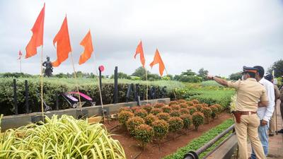 Cops examine the Adani Airport signage vandalised by Shiv Sena workers on the Western Express Highway in Mumbai on Monday. (Vijay Bate/HT) Cops examine the Adani Airport signage vandalised by Shiv Sena workers on the Western Express Highway in Mumbai on Monday. (Vijay Bate/HT)