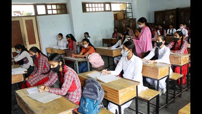 Students following Covid safety protocol while attending classes at a school in Mandi district on Monday. (Birbal Sharma/HT) Students following Covid safety protocol while attending classes at a school in Mandi district on Monday. (Birbal Sharma/HT)