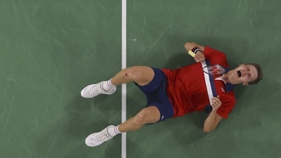 Tokyo 2020 Olympics - Badminton - Men's Singles - Gold medal match - MFS - Musashino Forest Sport Plaza, Tokyo, Japan – August 2, 2021.  Viktor Axelsen of Denmark reacts on the court after winning the match against Chen Long of China. Pool via REUTERS/Lintao Zhang (Pool via REUTERS)