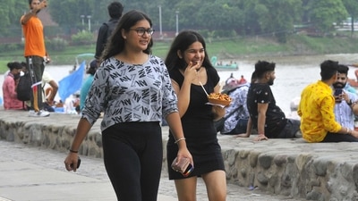 Two young girls take a stroll around the lake as they enjoy a plate of chaat at Sukhna Lake in Chandigarh on August 1. (Keshav Singh/Hindustan Times) Two young girls take a stroll around the lake as they enjoy a plate of chaat at Sukhna Lake in Chandigarh on August 1. (Keshav Singh/Hindustan Times)