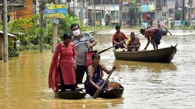 Locals using boats to cross the waterlogged street due to a flood following the Shilaboty river and Kangshaboti rivers overflowing in Ghatal on Monday. (ANI PHOTO.) Locals using boats to cross the waterlogged street due to a flood following the Shilaboty river and Kangshaboti rivers overflowing in Ghatal on Monday. (ANI PHOTO.)