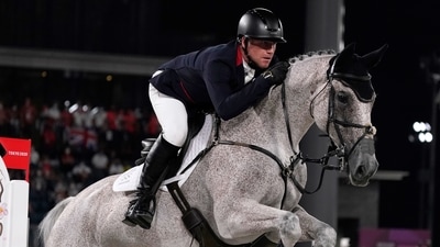 Britain's Oliver Townend, riding Ballaghmor Class, competes during the equestrian eventing jumping individual final at Equestrian Park in Tokyo at the 2020 Summer Olympics, Monday, Aug. 2, 2021, in Tokyo, Japan. (AP Photo/Carolyn Kaster) (AP) Britain's Oliver Townend, riding Ballaghmor Class, competes during the equestrian eventing jumping individual final at Equestrian Park in Tokyo at the 2020 Summer Olympics, Monday, Aug. 2, 2021, in Tokyo, Japan. (AP Photo/Carolyn Kaster) (AP)