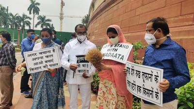 SAD leader Harsimrat Kaur Badal along with BSP leaders stages a protest against farm laws, at Parliament in New Delhi on Monday. (ANI)