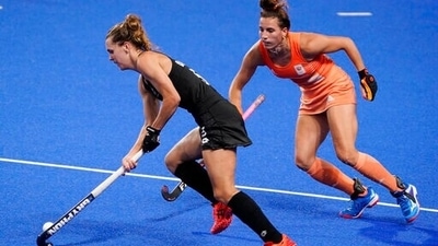 New Zealand's Frances Davies (5) drives around Netherlands' Frederique Matla (15) during a women's field hockey match at the 2020 Summer Olympics, Monday, Aug. 2, 2021, in Tokyo, Japan. (AP Photo/John Minchillo) (AP) New Zealand's Frances Davies (5) drives around Netherlands' Frederique Matla (15) during a women's field hockey match at the 2020 Summer Olympics, Monday, Aug. 2, 2021, in Tokyo, Japan. (AP Photo/John Minchillo) (AP)