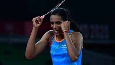 India's P. V. Sindhu celebrates after beating China's He Bingjiao in their women's singles badminton bronze medal match during the Tokyo 2020 Olympic Games at the Musashino Forest Sports Plaza in Tokyo on August 1, 2021. (AFP)