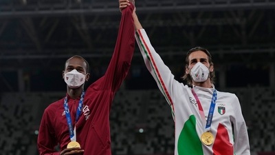 Joint gold medalists Mutaz Barshim of Qatar and Gianmarco Tamberi (R) of Italy pose for a photo following the men's high jump final at Tokyo Olympics (AP) Joint gold medalists Mutaz Barshim of Qatar and Gianmarco Tamberi (R) of Italy pose for a photo following the men's high jump final at Tokyo Olympics (AP)