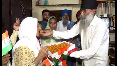 Gurjit Kaur’s family celebrates Indian team’s win against Australia.