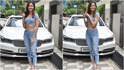 Ananya teamed her crop top with distressed denims, chunky white sneakers, and a black face mask. She left her locks open in a side parting with the attire, and for glam, she chose minimal make-up with a dash of mascara on the lashes. (Varinder Chawla) Ananya teamed her crop top with distressed denims, chunky white sneakers, and a black face mask. She left her locks open in a side parting with the attire, and for glam, she chose minimal make-up with a dash of mascara on the lashes. (Varinder Chawla)