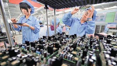 Employees work at a production line of electronic panels at a factory. The fact that July 2021 PMI manufacturing value is greater than 50 means that level of economic activity, as captured by the five indices, was higher than what it was in June. (Representational image/REUTERS) Employees work at a production line of electronic panels at a factory. The fact that July 2021 PMI manufacturing value is greater than 50 means that level of economic activity, as captured by the five indices, was higher than what it was in June. (Representational image/REUTERS)
