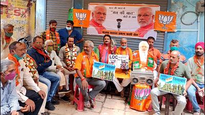 BJP party workers listen to PM Narendra Modi’s Mann ki Baat on radio, at Gita Mandir on New Road, in Varanasi recently (ANI Photo) BJP party workers listen to PM Narendra Modi’s Mann ki Baat on radio, at Gita Mandir on New Road, in Varanasi recently (ANI Photo)