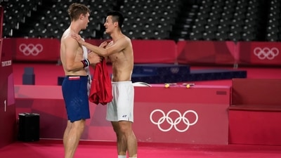 Denmark's Victor Axelsen, left, and China's Chen Long exchanges their t-shirts after Axelsen won men's singles gold medal Badminton match at the 2020 Summer Olympics, Monday, Aug. 2, 2021, in Tokyo, Japan. (AP Photo/Markus Schreiber) (AP) Denmark's Victor Axelsen, left, and China's Chen Long exchanges their t-shirts after Axelsen won men's singles gold medal Badminton match at the 2020 Summer Olympics, Monday, Aug. 2, 2021, in Tokyo, Japan. (AP Photo/Markus Schreiber) (AP)