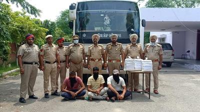 Three drug peddlers arrested by Punjab Police from a bus at Phagwara bypass near Kapurthala with 15-kg of ganja. (HT Photo)