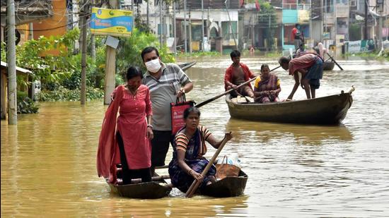 Locals using boats to cross the waterlogged street due to a flood following the Shilaboty river and Kangshaboti rivers overflowing in Ghatal on Monday. (ANI PHOTO.) Locals using boats to cross the waterlogged street due to a flood following the Shilaboty river and Kangshaboti rivers overflowing in Ghatal on Monday. (ANI PHOTO.)