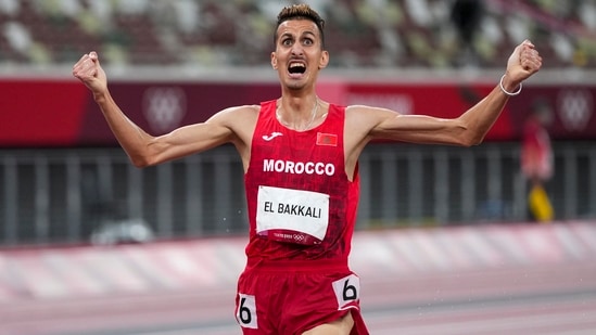 Tokyo : Soufiane El Bakkali, of Morocco, celebrates after winning the men's 3,000-meter steeplechase final at the 2020 Summer Olympics, Monday, Aug. 2, 2021, in Tokyo.AP/PTI Photo(AP08_02_2021_000284B)(AP)
