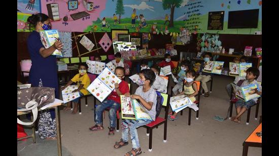 Pre-primary students attending a class at Government Primary School in Gobind Nagar, Ludhiana, on Monday. (Harsimar Pal Singh/HT)