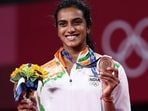 India's PV Sindhu poses with her bronze medal in women's singles badminton event at the Tokyo Olympics 2020(Twitter)