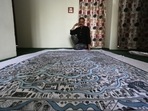 Artist Maqbool Jan with a cloth map of Srinagar city, in Jammu and Kashmir, India, on Monday 2, 2021.(Photo by Waseem Andrabi/Hindustan Times) Artist Maqbool Jan with a cloth map of Srinagar city, in Jammu and Kashmir, India, on Monday 2, 2021.(Photo by Waseem Andrabi/Hindustan Times)