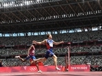 Norway's Karsten Warholm (R) crosses the finish line to win and break the world record ahead of second-placed USA's Rai Benjamin in the men's 400m hurdles final at the Tokyo 2020 Olympic Games(AFP) Norway's Karsten Warholm (R) crosses the finish line to win and break the world record ahead of second-placed USA's Rai Benjamin in the men's 400m hurdles final at the Tokyo 2020 Olympic Games(AFP)