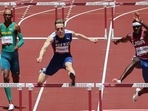 Norway's Karsten Warholm (C) USA's Rai Benjamin (2R) and Brazil's Alison Dos Santos (L) compete in the men's 400m hurdles final during the Tokyo 2020 Olympic Games