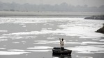 A man rows a boat in the heavily polluted waters of the Yamuna River. (Biplov Bhuyan/HT PHOTO) A man rows a boat in the heavily polluted waters of the Yamuna River. (Biplov Bhuyan/HT PHOTO)