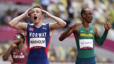 Karsten Warholm of Norway celebrates as he wins the gold medal in the final of the men's 400-meter hurdles at the 2020 Summer Olympics, in Tokyo on August 3. One of the most anticipated races on the program more than lived up to the hype as Warholm set a ridiculous world record to hold off American Rai Benjamin and take gold in the men's 400 metres hurdles, in what will go down as perhaps the greatest of Olympic races. (Martin Meissner / AP) Karsten Warholm of Norway celebrates as he wins the gold medal in the final of the men's 400-meter hurdles at the 2020 Summer Olympics, in Tokyo on August 3. One of the most anticipated races on the program more than lived up to the hype as Warholm set a ridiculous world record to hold off American Rai Benjamin and take gold in the men's 400 metres hurdles, in what will go down as perhaps the greatest of Olympic races. (Martin Meissner / AP)
