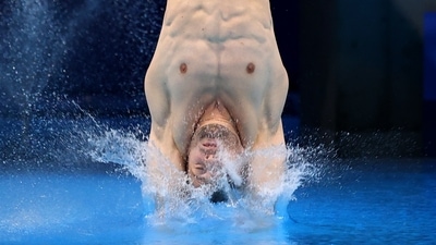 Alexis Jandard of France in action during the Men's 3m Springboard Semifinal at Tokyo Aquatics Centre on August 3. Chinese divers continued to lead the way in the semi-finals for the men's 3 metre springboard diving at the Tokyo Games, after Xie Siyi and Wang Zongyuan produced a series of impressive dives to claim the top two spots. (Antonio Bronic / REUTERS) Alexis Jandard of France in action during the Men's 3m Springboard Semifinal at Tokyo Aquatics Centre on August 3. Chinese divers continued to lead the way in the semi-finals for the men's 3 metre springboard diving at the Tokyo Games, after Xie Siyi and Wang Zongyuan produced a series of impressive dives to claim the top two spots. (Antonio Bronic / REUTERS)
