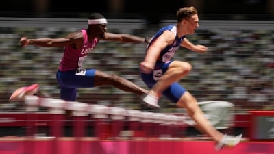 Karsten Warholm of Norway leads Rai Benjamin of United States in the final of the men's 400-meter hurdles at the Olympic Games in Tokyo on August 3. Warholm stormed over the line in an incredible 45.94 seconds, slicing a massive 0.8sec off his own world mark of 46.70 set in Oslo last month. Second-place finisher Rai Benjamin finished in 46.17, also bettering the 46.7 record that Warholm set just last month. (Francisco Seco / AP) Karsten Warholm of Norway leads Rai Benjamin of United States in the final of the men's 400-meter hurdles at the Olympic Games in Tokyo on August 3. Warholm stormed over the line in an incredible 45.94 seconds, slicing a massive 0.8sec off his own world mark of 46.70 set in Oslo last month. Second-place finisher Rai Benjamin finished in 46.17, also bettering the 46.7 record that Warholm set just last month. (Francisco Seco / AP)