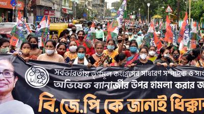West Bengal:TMC supporters hold flags and banners during a protest against the attack on TMC general secretary Abhishek Banerjee in Kolkata on Tuesday. (ANI) West Bengal:TMC supporters hold flags and banners during a protest against the attack on TMC general secretary Abhishek Banerjee in Kolkata on Tuesday. (ANI)