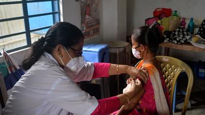 A healthcare worker inoculates a woman with a dose of vaccine against Covid-19 at a primary health centre in Siliguri on August 2. DUTTA / AFP) (AFP) A healthcare worker inoculates a woman with a dose of vaccine against Covid-19 at a primary health centre in Siliguri on August 2. DUTTA / AFP) (AFP)