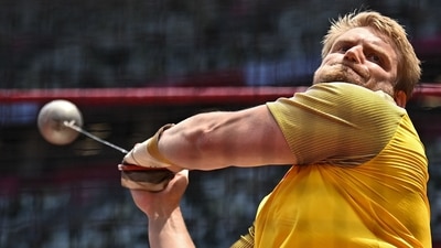 Germany's Tristan Schwandke competes in the men's hammer throw qualification during the Tokyo 2020 Olympic Games at the Olympic Stadium in Tokyo on August 2, 2021. (Photo by Ben STANSALL / AFP) (AFP) Germany's Tristan Schwandke competes in the men's hammer throw qualification during the Tokyo 2020 Olympic Games at the Olympic Stadium in Tokyo on August 2, 2021. (Photo by Ben STANSALL / AFP) (AFP)