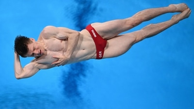 Germany's Martin Wolfram competes in the men's 3m springboard diving semi-final event during the Tokyo 2020 Olympic Games at the Tokyo Aquatics Centre in Tokyo on August 3, 2021. (Photo by Oli SCARFF / AFP) (AFP) Germany's Martin Wolfram competes in the men's 3m springboard diving semi-final event during the Tokyo 2020 Olympic Games at the Tokyo Aquatics Centre in Tokyo on August 3, 2021. (Photo by Oli SCARFF / AFP) (AFP)