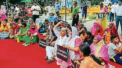 Women protest on Pankha Road against the incident. ht photo (HT_Print) Women protest on Pankha Road against the incident. ht photo (HT_Print)