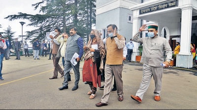 Leader of Opposition in HP assembly, Mukesh Agnihotri, along with other Congress legislators walk out from the Vidhan Sabha in Shimla on Tuesday. (Deepak Sansta/HT) Leader of Opposition in HP assembly, Mukesh Agnihotri, along with other Congress legislators walk out from the Vidhan Sabha in Shimla on Tuesday. (Deepak Sansta/HT)