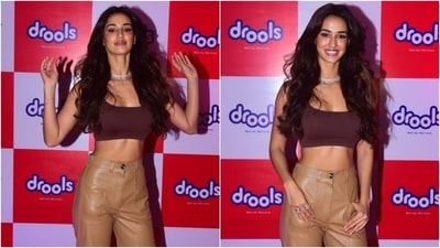 Straight-fit and high-rise leather pants in light brown shade completed her outfit for the day out. The faux leather pants featured pocket details on the front and back and a flared hem. (Varinder Chawla)