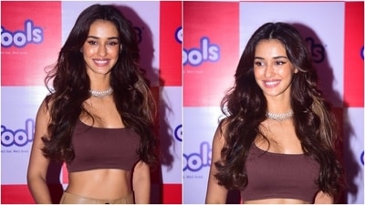 Disha wore the ensemble with clear strappy sandals, a black face mask, silver rings, and a chunky choker necklace. The actor styled her open middle-parted locks in defined curls. (Varinder Chawla)