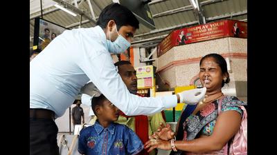 A healthcare worker collects a nasal sample of a woman passenger for the COVID-19 test on her arrival at Charbagh railway station, in Lucknow (ANI file photo)