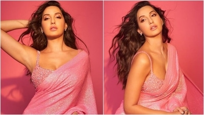 Nora Fatehi in pink sequin saree and bralette will make your heart skip a beat (Instagram/@manekaharisinghani) Nora Fatehi in pink sequin saree and bralette will make your heart skip a beat (Instagram/@manekaharisinghani)