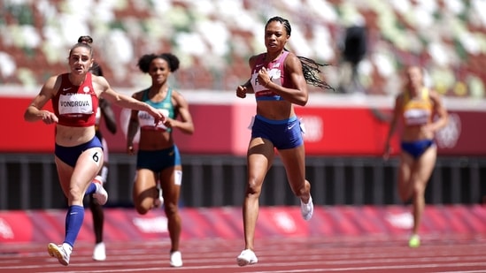 Allyson Felix of the United States crosses the finish line to win Heat 3 ahead of Lada Vondrova of Czech Republic during Women's 400m Round 1, at Olympic Stadium in Tokyo on August 3. Felix won her first-round heat of the 400 meters as she began her Tokyo quest for a 10th Olympic medal. The 35-year-old Felix, who’s competing at her fifth Olympics, has six gold medals and three silvers on her resume.(Hannah Mckay / REUTERS)