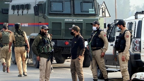 Jammu and Kashmir Police stand guard at an encounter site, in Kulgam.(ANI File Photo)